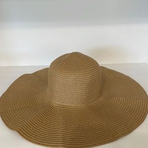 A Packable Beach Hat inside circumference 23 inches estimate. Pull ribbon adj.